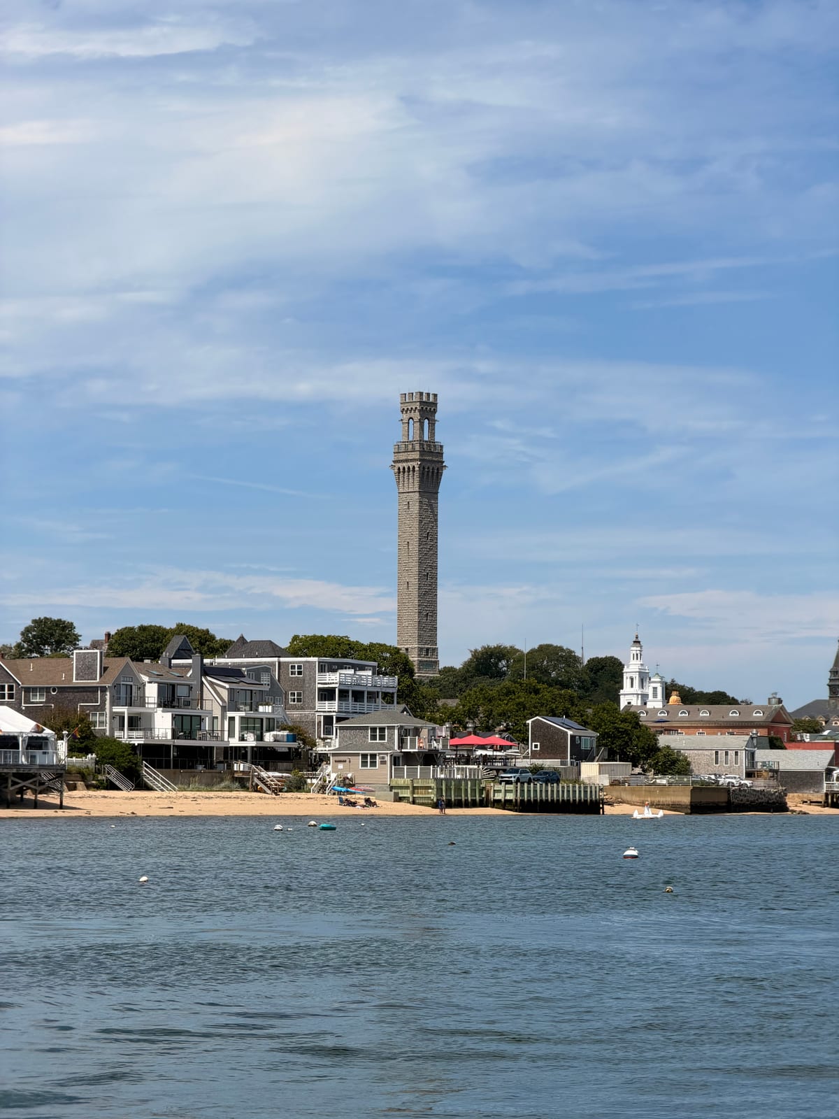 Provincetown waterfront and Pilgrim Monument viewed from across the harbor