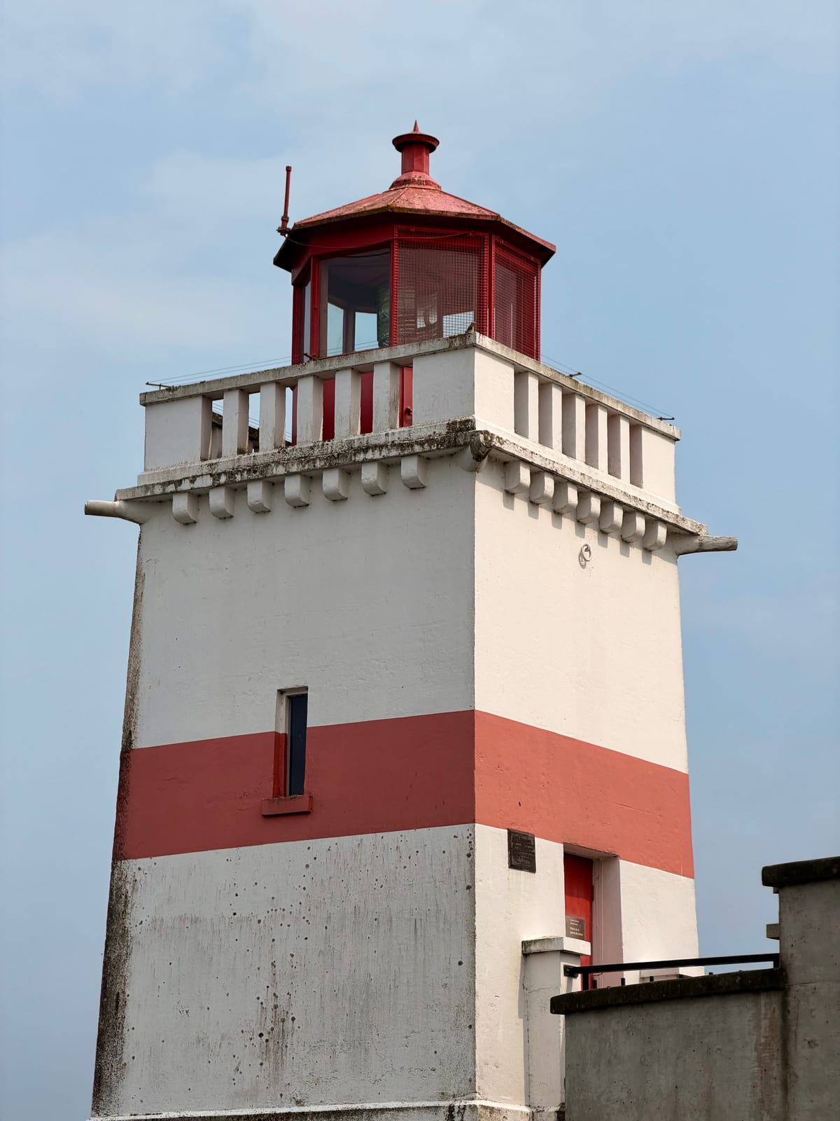The red-and-white Brockton Point lighthouse against a clear blue sky